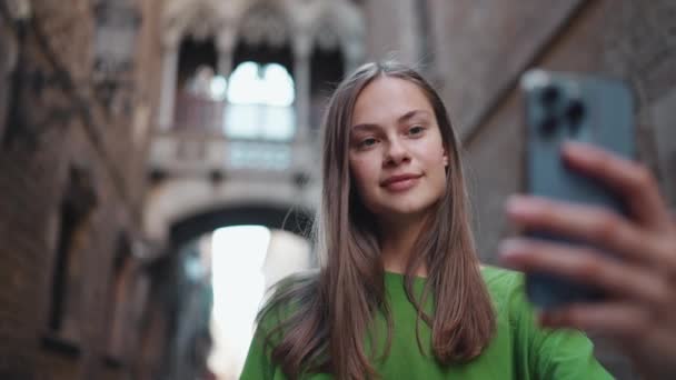 Smiling Blonde Woman Wearing Green Shirt Making Selfie Phone Street — Stock Video