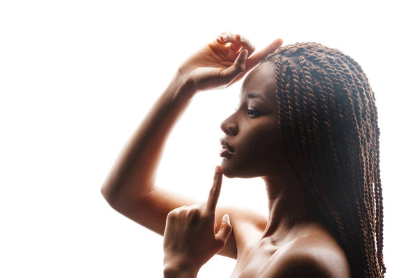 Half-naked black woman gesturing and looking aside isolated over white background
