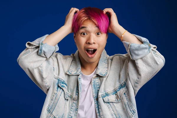 Asian Boy Expressing Surprise While Holding His Head Isolated Blue — Stock Photo, Image