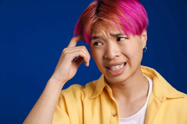 Asian Boy Pink Hair Grimacing While Rubbing His Temple Isolated — Stock Photo, Image