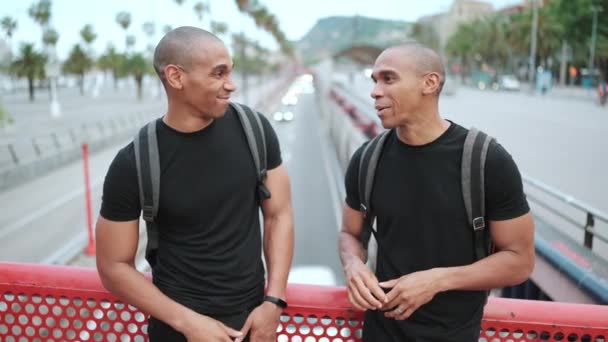 Two Handsome Bald African Brothers Talking Bridge Outdoors — Stock Video