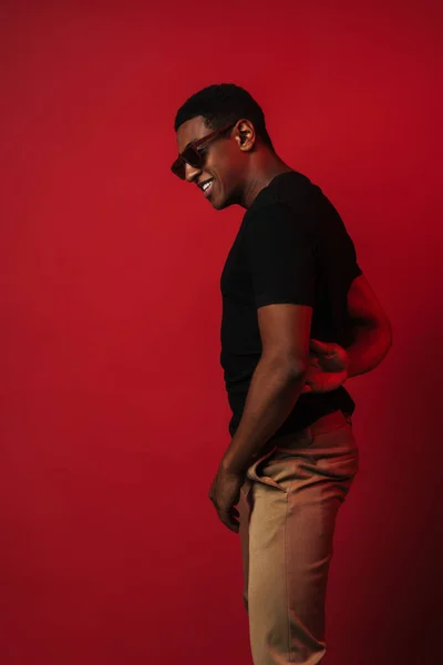 Young Black Man Wearing Sunglasses Laughing Looking Aside Isolated Red — Stockfoto