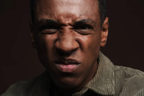 Young Black Man Frowning Looking Camera Isolated Brown Wall — Stock Photo, Image