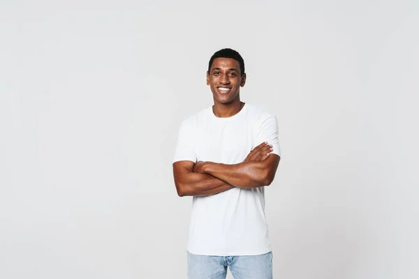 Young Black Man Smiling While Posing Arms Crossed Isolated White — Stockfoto