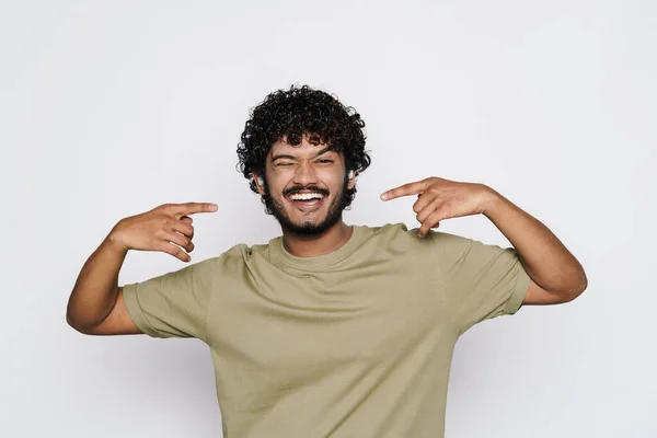 Young Middle Eastern Man Earphones Pointing Fingers His Smile Isolated — 스톡 사진