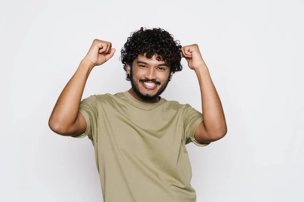 Young Middle Eastern Man Dancing While Listening Music Earphones Isolated — Stockfoto
