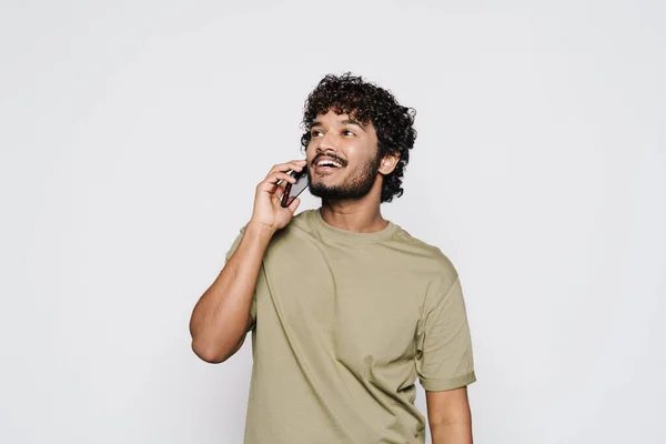 Young Middle Eastern Man Smiling While Talking Cellphone Isolated White — Stockfoto