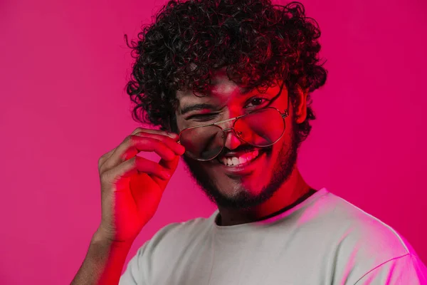 Young Middle Eastern Man Sunglasses Smiling Winking Camera Isolated Pink — Stock fotografie