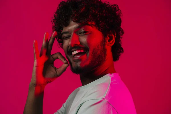 Young Middle Eastern Man Winking Showing Sign Isolated Pink Wall — Fotografia de Stock