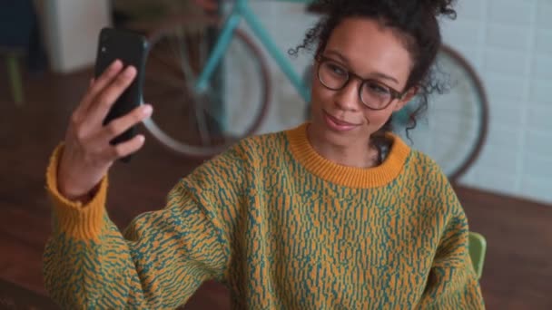Smiling Woman Wearing Yellow Sweater Eyeglasses Making Selfie Phone Cafe — Video Stock
