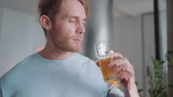 Confident Blond Athletic Man Drinking Orange Juice Kitchen Home — Video