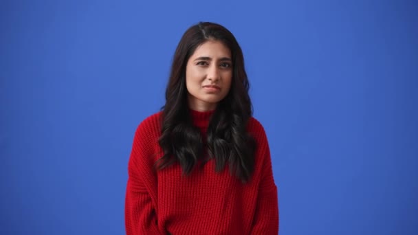 Displeased Indian Brunette Woman Spreading Hands Isolated Blue Background — Stock video