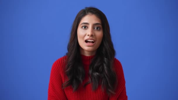 Cute Indian Brunette Woman Rejoicing Camera Isolated Blue Background — Stockvideo