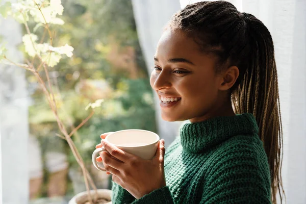 Young Black Woman Pigtails Smiling While Drinking Tea Home — 스톡 사진