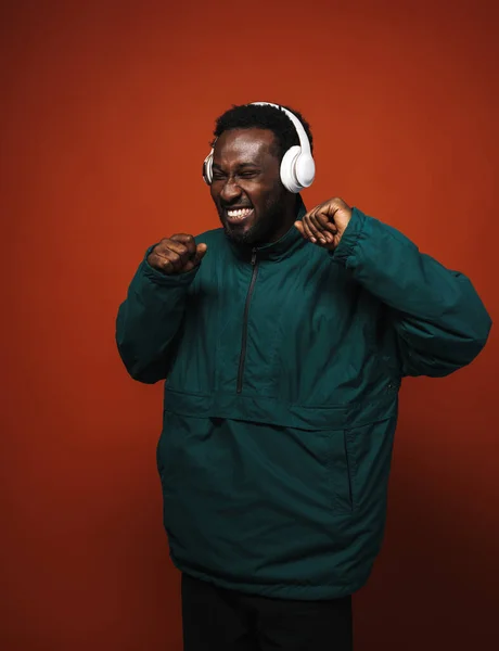 Black Bristle Man Dancing While Listening Music Headphones Isolated Brown — Stockfoto