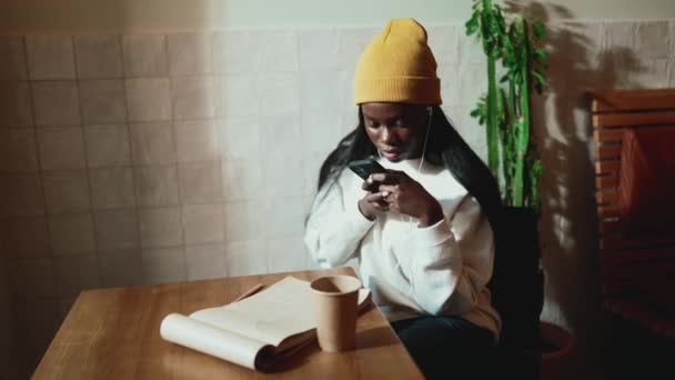 Concentrated African Young Woman Wearing White Sweater Making Photo Document — Wideo stockowe