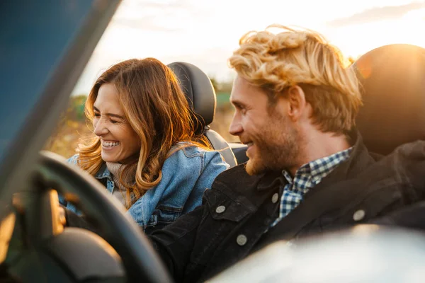 White Mid Couple Smiling Together While Driving Car Trip — Stockfoto