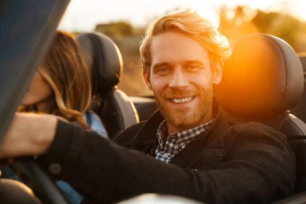White Mid Couple Smiling Together While Driving Car Trip — Stockfoto