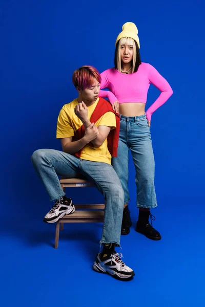 Asian Couple Multicolored Hair Posing Camera Isolated Blue Wall — Fotografia de Stock