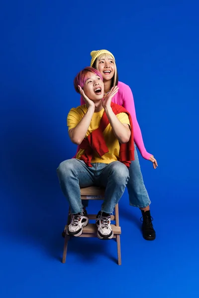 Asian Couple Multicolored Hair Making Fun Together Isolated Blue Wall — Fotografia de Stock