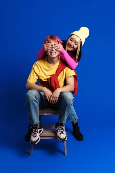 Asian Girl Covering His Boyfriend Eyes While Making Fun Together — Fotografia de Stock