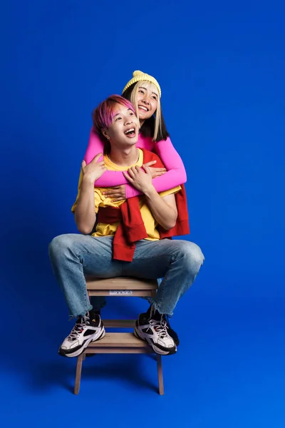 Asian Couple Multicolored Hair Making Fun Together Isolated Blue Wall — Fotografia de Stock