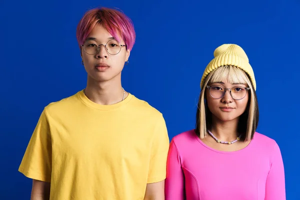 Asian Teenagers Eyeglasses Posing Looking Camera Isolated Blue Wall — Fotografia de Stock