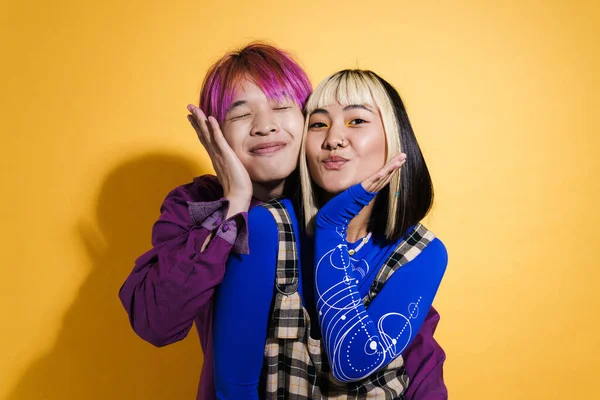 Asian Couple Multicolored Hair Smiling Gesturing Together Isolated Yellow Wall — Fotografia de Stock