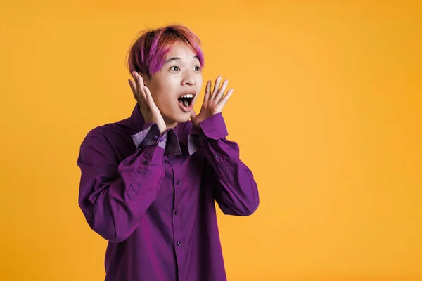 Asian Boy Pink Hair Gesturing While Expressing Surprise Isolated Yellow — 스톡 사진