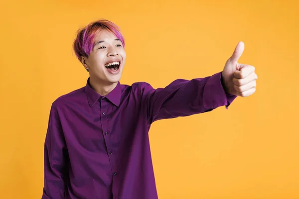 Asian Boy Pink Hair Laughing While Showing Thumb Isolated Yellow — Stock fotografie