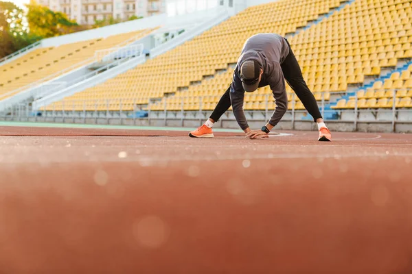 Young Sportsman Doing Exercise While Working Out Stadium Outdoors — ストック写真