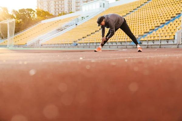 Young White Runner Doing Exercise While Working Out Stadium Outdoors — Foto de Stock