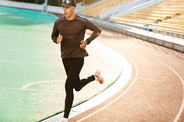 Young White Sportsman Running While Working Out Stadium Outdoors — Fotografia de Stock