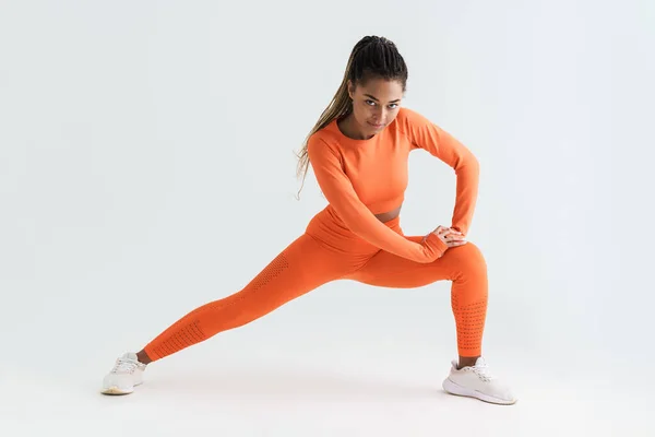 Black Young Sportswoman Doing Exercise While Working Out Isolated White — Stock fotografie