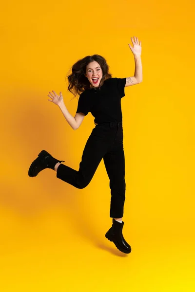 White Excited Woman Black Shirt Making Fun Jumping Isolated Yellow — Foto Stock