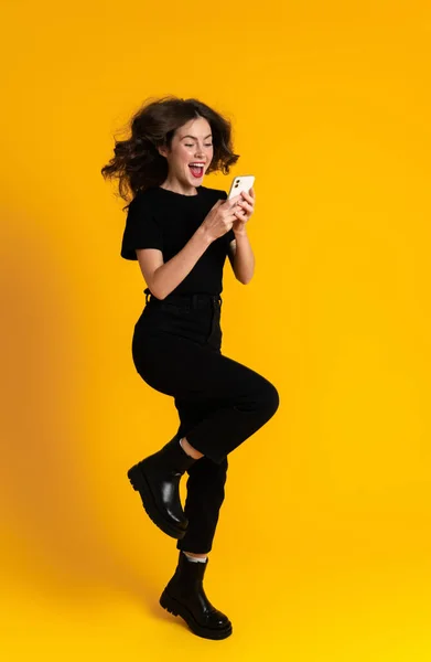 White Excited Woman Making Fun While Using Mobile Phone Isolated —  Fotos de Stock