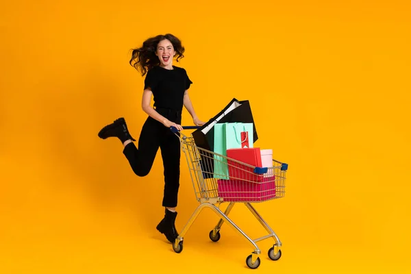 White Excited Woman Laughing While Posing Shopping Cart Isolated Yellow — Foto de Stock