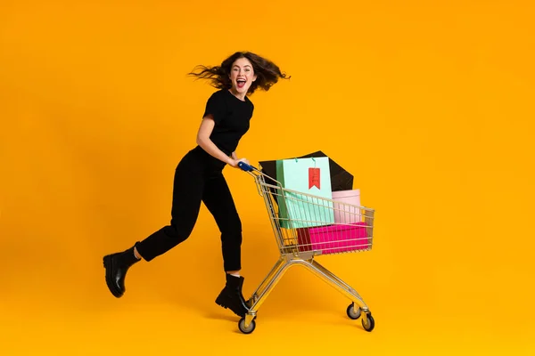 White Excited Woman Laughing While Posing Shopping Cart Isolated Yellow — Photo
