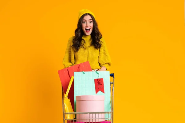 Excited Woman Screaming While Posing Shopping Cart Isolated Yellow Background — стоковое фото