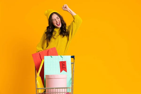 White Woman Making Winner Gesture While Posing Shopping Cart Isolated — Photo