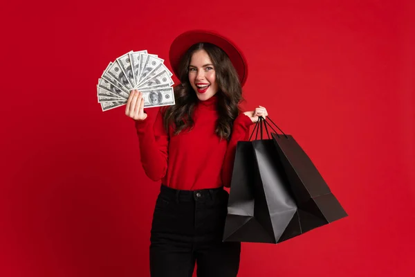 White Woman Laughing While Posing Shopping Bags Dollars Isolated Red — Zdjęcie stockowe