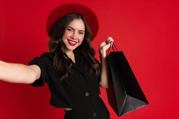White Young Woman Taking Selfie Photo Shopping Bags Isolated Red — Stock Fotó