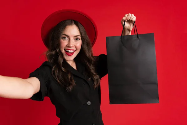 White Young Woman Taking Selfie Photo Shopping Bags Isolated Red — Stockfoto