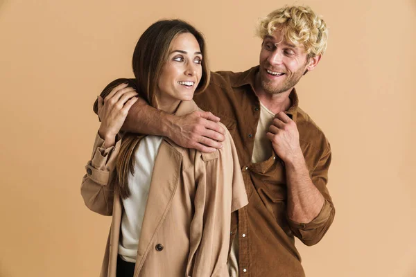 White Blonde Couple Smiling Looking Each Other Isolated Beige Background — Foto de Stock
