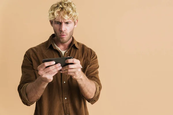 White Blonde Man Wearing Shirt Playing Online Game Cellphone Isolated — стоковое фото