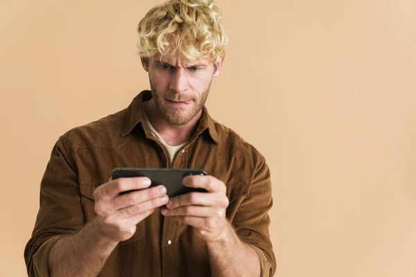 White Blonde Man Wearing Shirt Playing Online Game Cellphone Isolated — стоковое фото