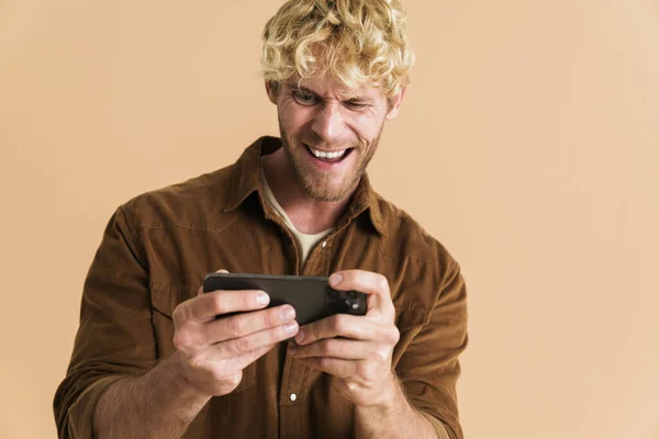 White Blonde Man Wearing Shirt Playing Online Game Cellphone Isolated — стоковое фото