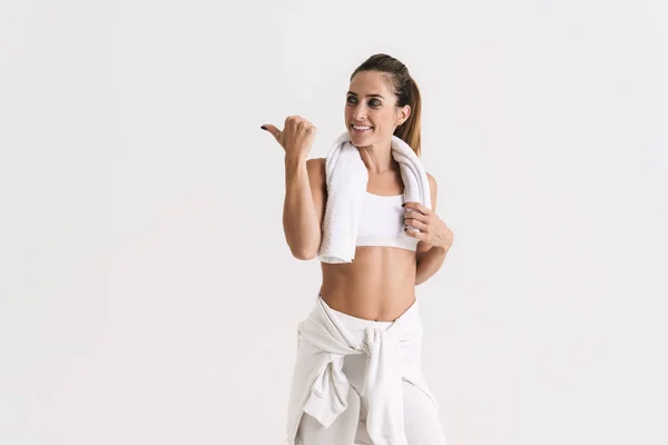 European Woman Sportswear Smiling Pointing Finger Aside Isolated White Background — Zdjęcie stockowe