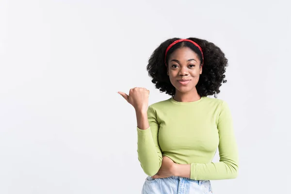 Young Black Woman Smiling Pointing Finger Aside Isolated White Background — Stockfoto