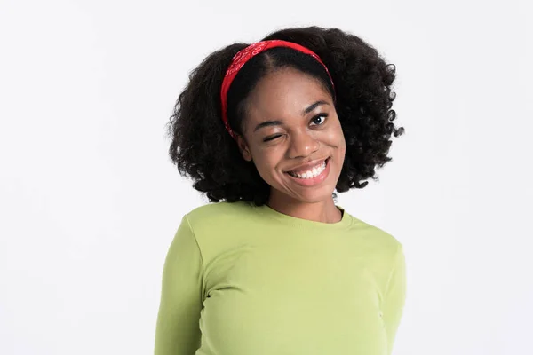 Young Black Woman Wearing Headband Smiling Winking Camera Isolated White — Fotografia de Stock